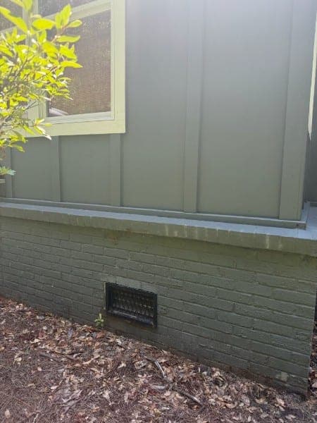 The same wall after soft washing, siding and brick clean