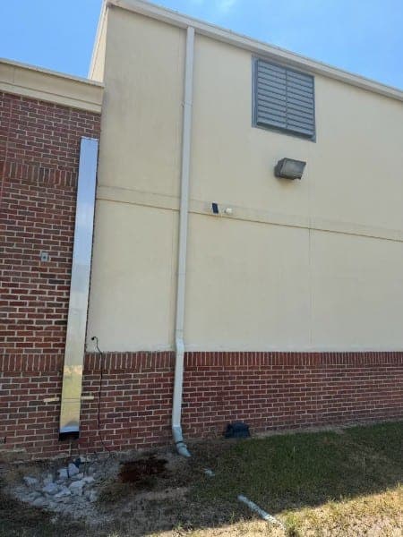 The same commercial wall after washing, panels and brick clean