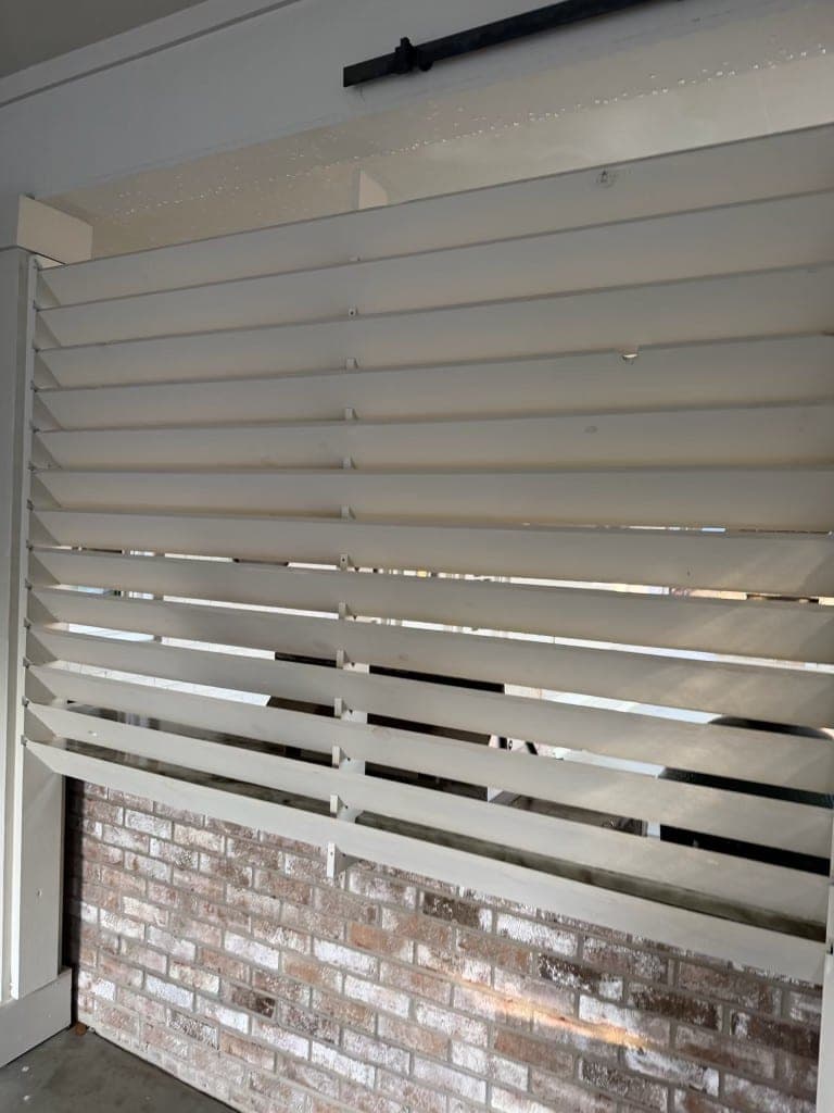 The same louvered screen after cleaning, paint bright and intact