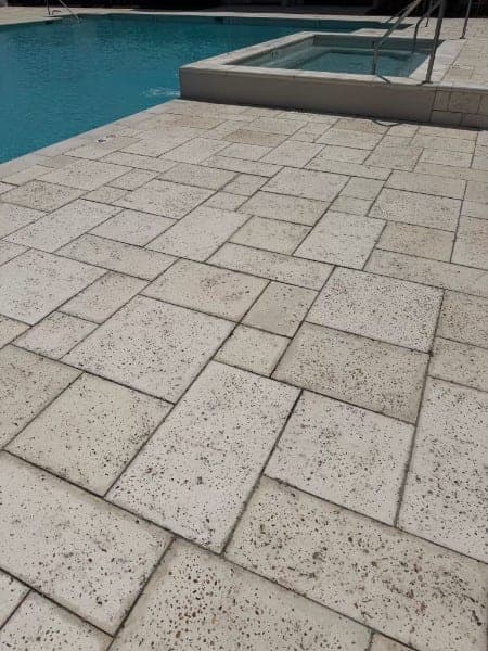 The same pool deck after cleaning, pavers uniform and bright