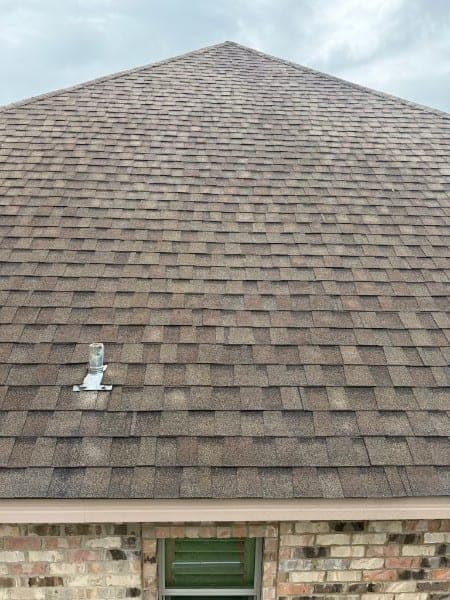 The same shingle roof after soft washing, streaks gone and shingles an even color
