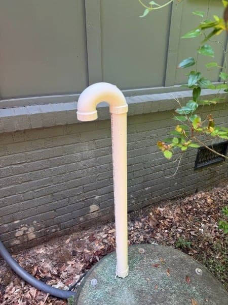The same standpipe and wall after rust treatment, staining gone